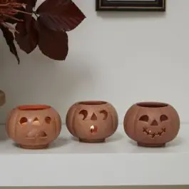 Editor’s Pick Stackable Grinning Pumpkin Votive Holders Set of 6